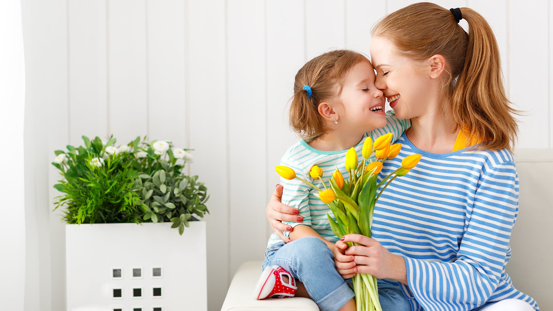 Baby sharing love with flowers